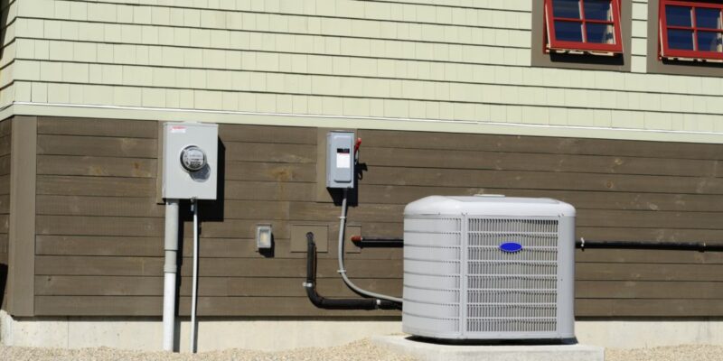 Heating and cooling unit installed outside of a residential home