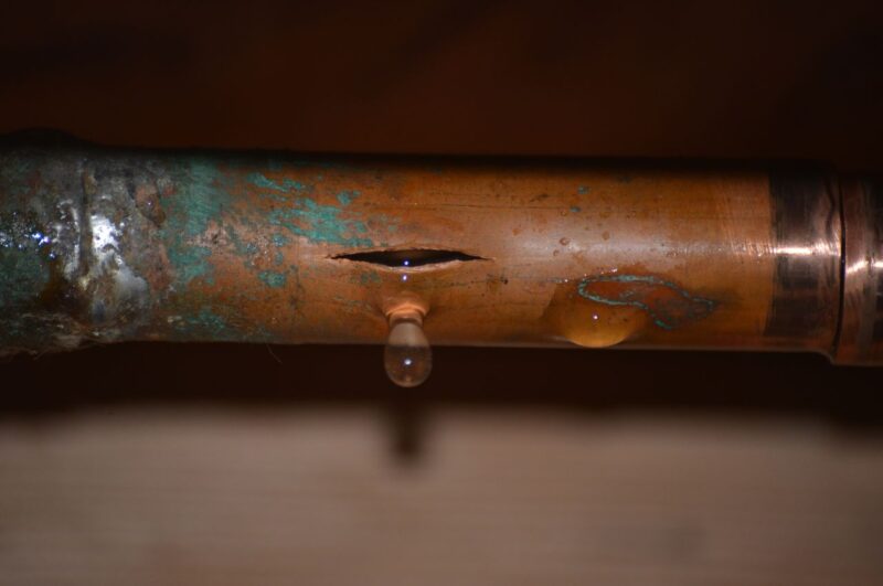 A burst copper pipe from assumedly winter weather.